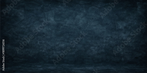 A dark blue vintage chalkboard backdrop with a grunge paper texture and an aged, dirty surface design for use as a blank wall wallpaper or empty textured pattern background