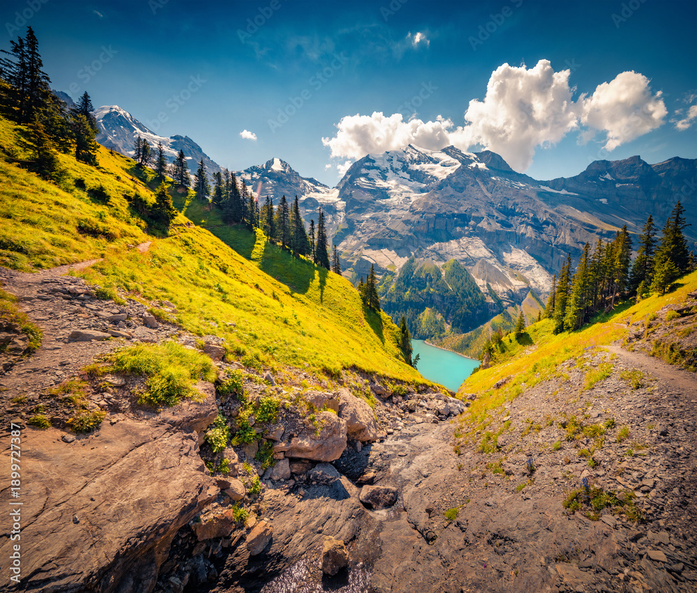 Naklejka premium Aerial summer view of Oeschinensee Lake. Bright afternoon landscape of Bluemlisalp peak, Kandersteg village location, Switzerland, Europe. Majestic outdoor scene of Swiss Alps. 