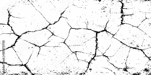 A rough grunge texture of an old cracked concrete wall featuring a dry pattern of broken cement and weathered paint on a dirty stone surface