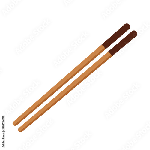 A pair of wooden chopsticks with brown tips lies on a plain surface.