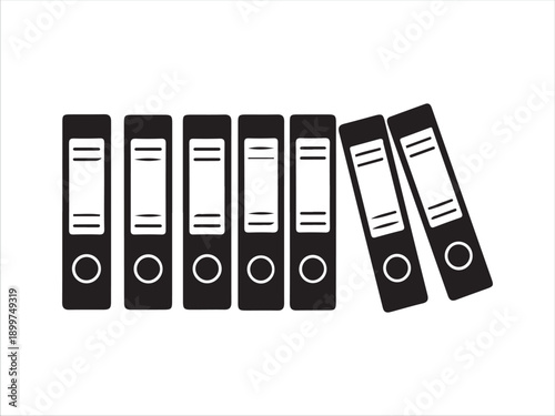 Set of black binders organized in a row with two falling over