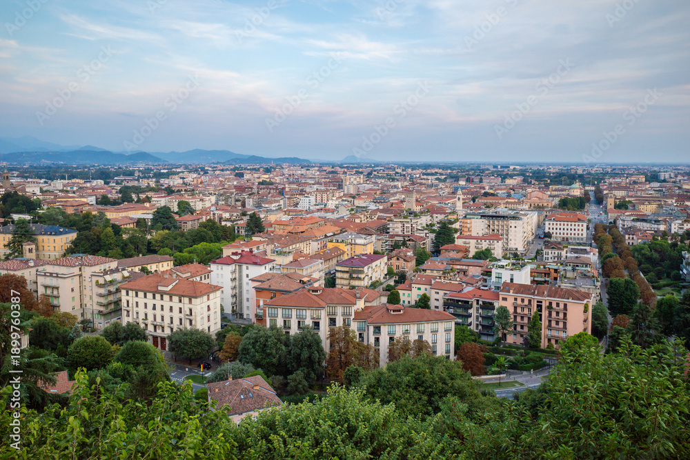 Fototapeta premium Elevated Panoramic View of Bergamo Lower Town Architecture and Cityscape at Sunset