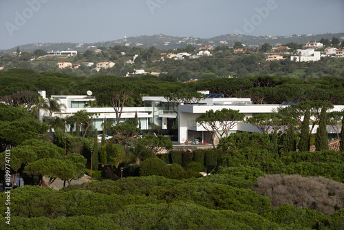 Aerial. View from the sky at the golf courses in the tourist town. Vilamoura.