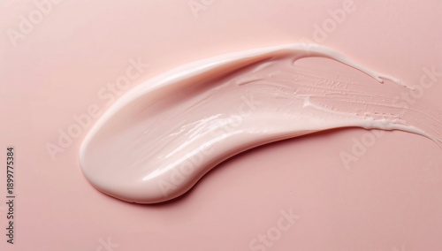 Swatch of Cream on Soft Pink Background Showing Texture and Shine in a Simple...