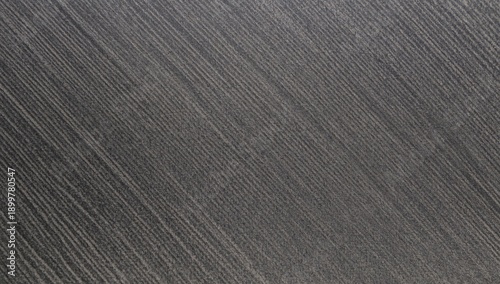 Texture of a Dark Surface With Lines and Patterns Captured in a Close View