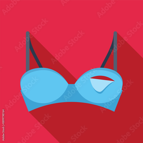 Blue bra with a breast implant visible through a tear, indicating plastic surgery
