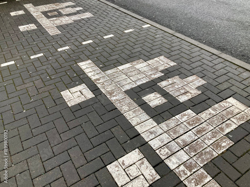 a playful twist of perspective, similar to spaceship icon of 8 bit retro video game in one parking bays painted, photos from a fresh angle