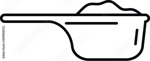 Detergent powder filling a measuring scoop for laundry washing