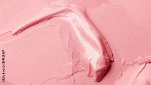 Soft Pink Paint Spread on a Surface in a Creative Workspace