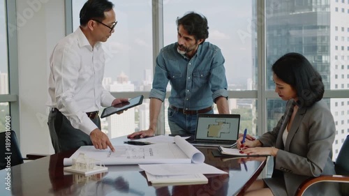 Video of architect and engineer at meeting in construction office with large table and drawings and documents on top of it.Slow motion.AI Generative.