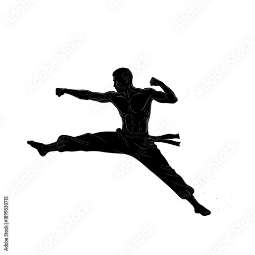 Silhouette of a muscular man in mid-air performing a martial arts jump.