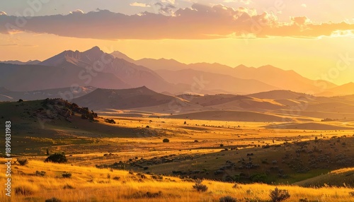 Plains with distant mountains, golden-hour light, vast open landscape