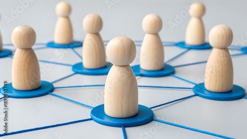 Teamwork and Network Concept – Wooden Peg Figures Connected by Blue Lines, Collaboration, Social Structure, Interpersonal Communication