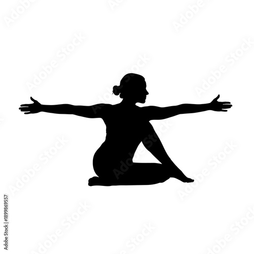Silhouette of woman in seated twist yoga pose.