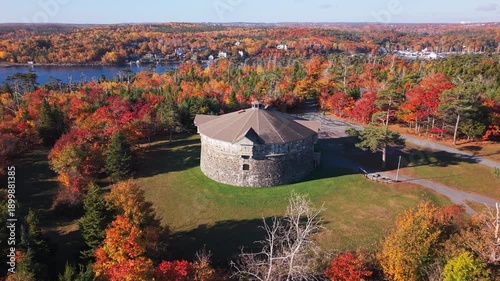 Beautiful Drone Shot Of Prince Of Wales Tower Illuminated By Soft Sunrise Light. Surrounded By Autumn Trees In Full Color In A Quiet Corner Of Halifax.