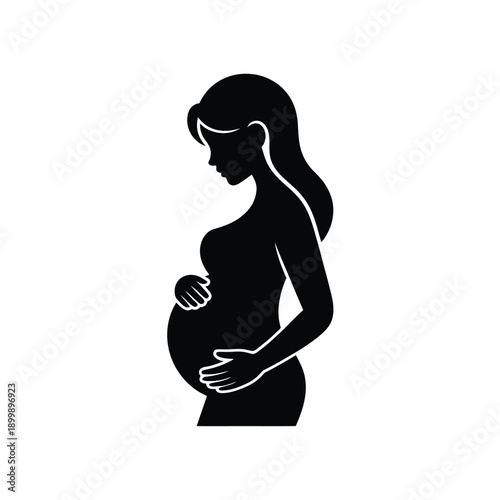 Silhouette of a pregnant woman in profile hands cradling her belly