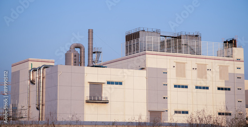 Photos Exterior view of a large pharmaceutical or high-tech manufacturing plant in an industrial zone