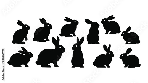A collection of black silhouettes of rabbits in various poses and positions Vector