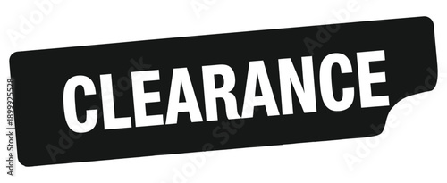 A black clearance sign with bold white lettering is prominently displayed