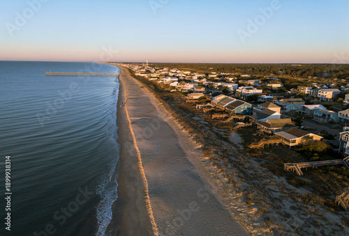 Quadro su tela Aerial view of the pier and beach homes at sunrise in Oak Island , in Brunswick
