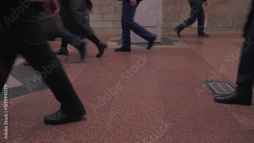 Crowded subway platform with anonymous commuters walking during rush hour