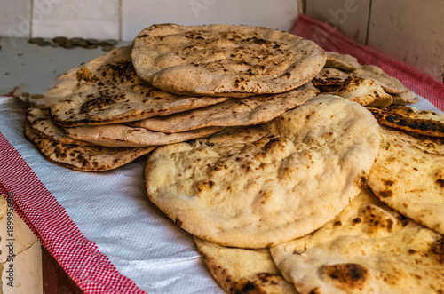 Traditional bahraini flatbread baking in a traditional clay oven in Muharraq