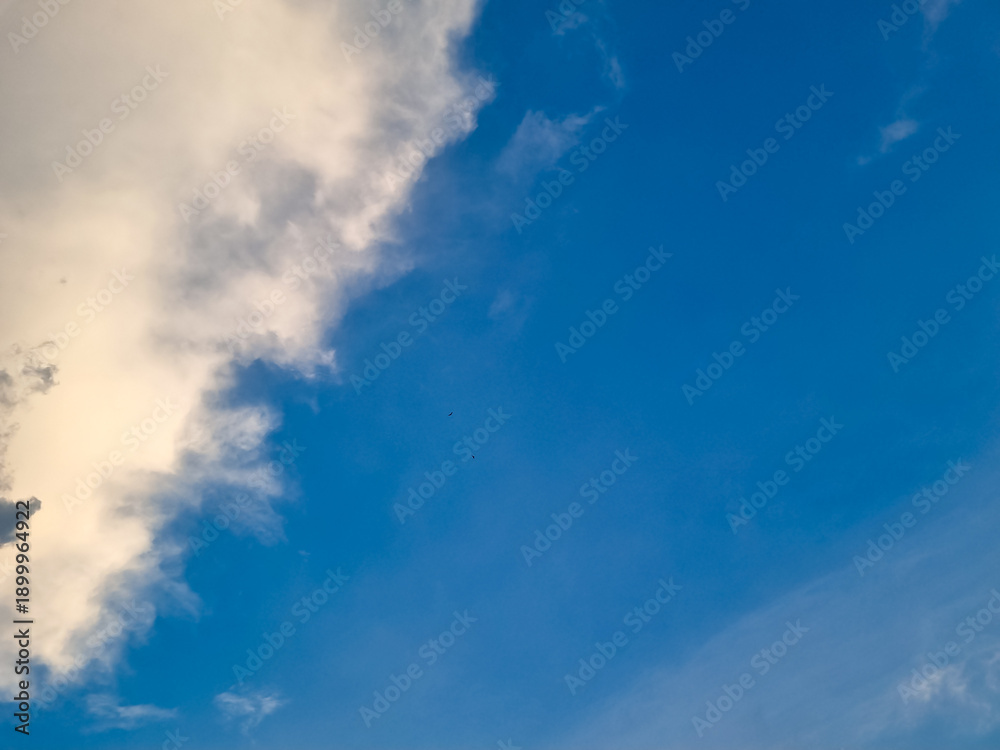 Fototapeta premium Bright Blue Sky with Soft White Cloud Frame and Copy Space