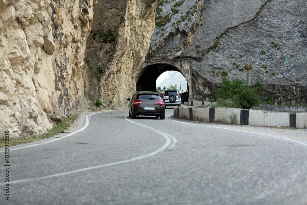 Fototapeta premium Car driving stunning mountain road background.