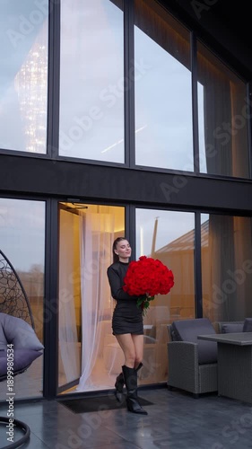 Wallpaper Mural Woman in mini dress and boots holding huge bouquet of roses. Romantic date concept. Torontodigital.ca