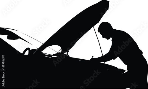 Mechanic inspecting car engine with hood up