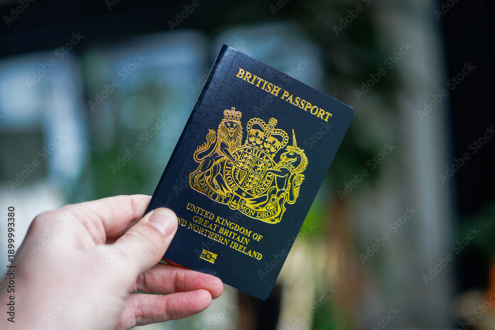 Ταπετσαρία British passport held in hand in a modern lifestyle setting, representing travel