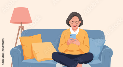 Elderly woman happily uses her smartphone while relaxing on a sofa at home