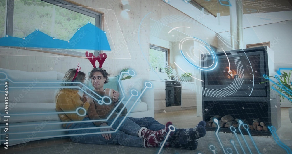 Obraz premium Leaning two women holding mugs on wood floor at home, in sweaters and antlers, holographic overlay