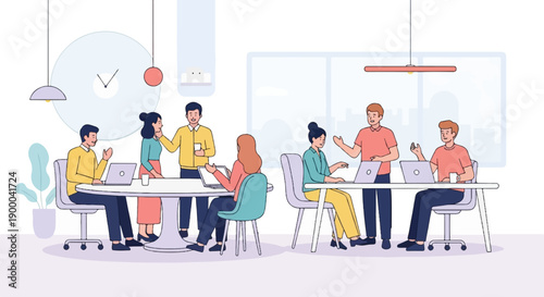 Diverse colleagues collaborate in a modern office environment with laptops