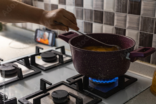 Tablou pe pânză These photos illustrate how meals are cooked on gas stovetops in kitchens, and how rising food prices are impacting natural gas costs