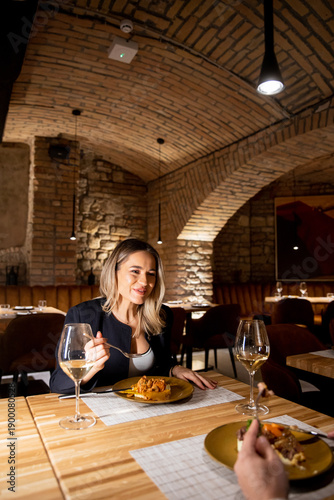 Woman enjoys dinner in a co...