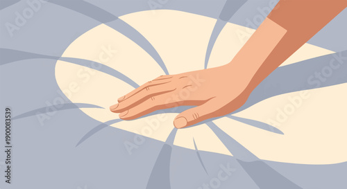 Gentle hand pressing into soft, cushioned surface with stylized folds