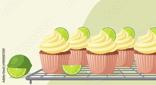 Light yellow frosted cupcakes with lime slices on a cooling rack