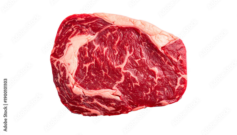 Obraz premium A raw, marbled ribeye steak, isolated on a black background, shows detailed texture
