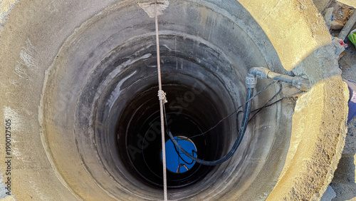 Slika na platnu Open well with water at the bottom