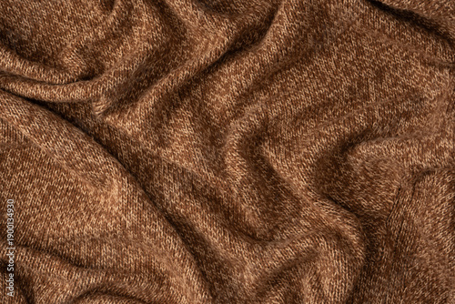 Soft brown merino wool sweater texture as a background. Top view.