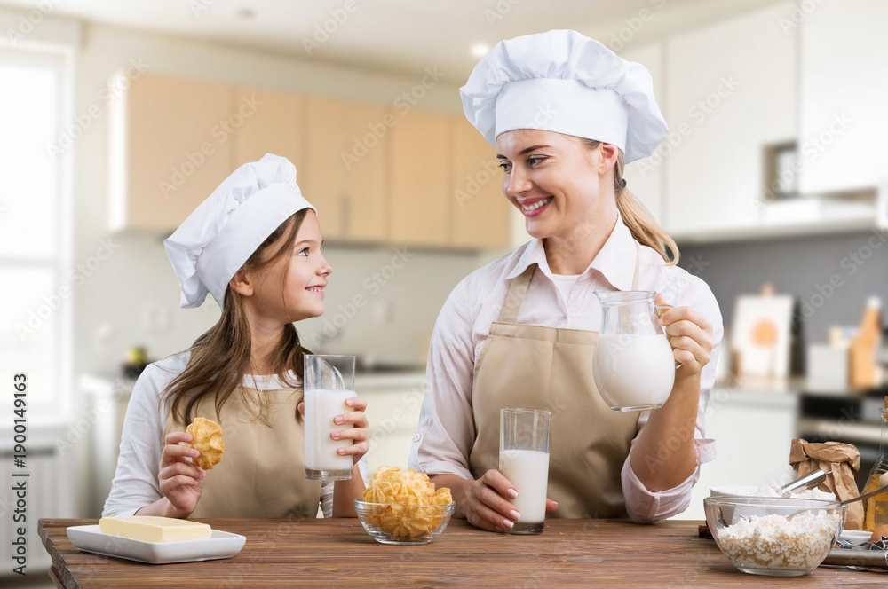 © BillionPhotos.com - Happy young mother with child cooking at home kitchen