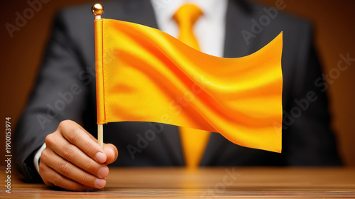 Businessman holding a small...