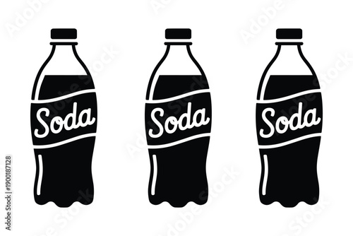 Three black and white soda bottles on a plain background