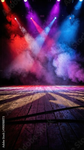 Stage lights illuminate smoky atmosphere with vibrant red, purple, and blue beams on wooden floor