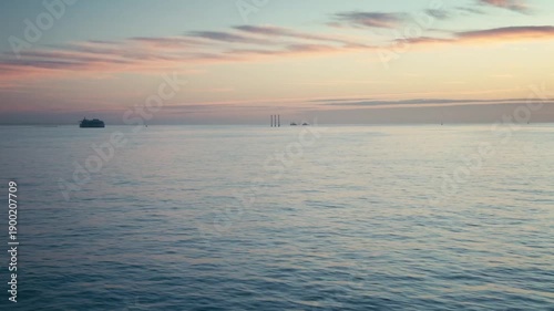 The view from a ship on a calm sunrise 
