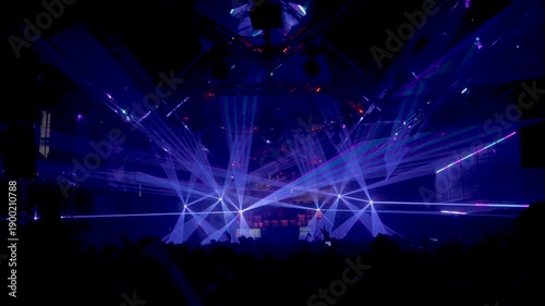 Nightclub Crowd Filming with Mobile Phones Under Laser Lights