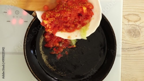 Process of cooking tomato sauce on the pan
