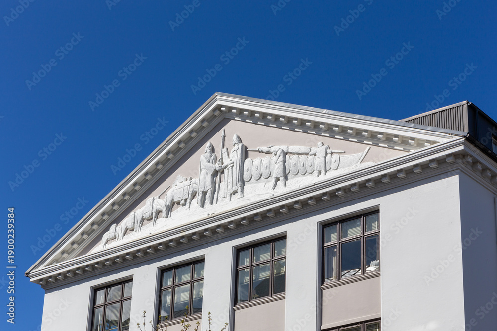 Fototapeta premium Reykjavik, Iceland, 14.05.22. Classical pediment relief with Viking history on historical building in Reykjavik Iceland.