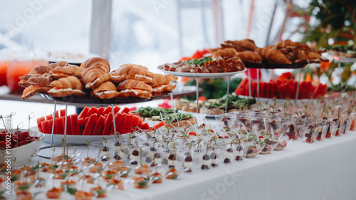 Billede på lærred Delicious Buffet Table with Croissants and Fruit